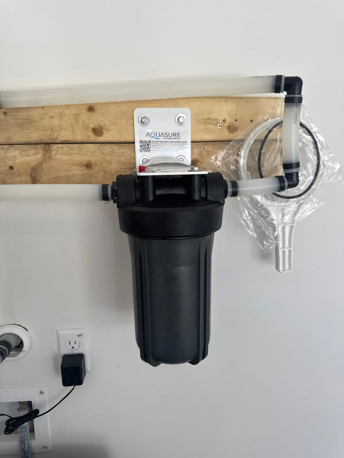 Whole-house water filter canister on copper piping